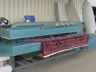 Battage, brossage et aspiration de tapis